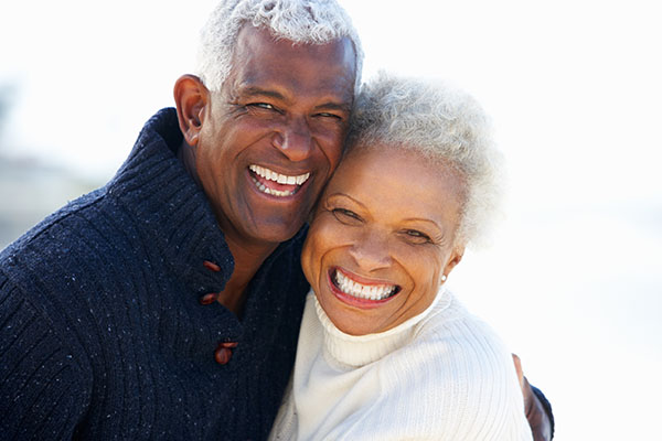 How An Implant Supported Dentures Dentist Can Help Replace Your Smile